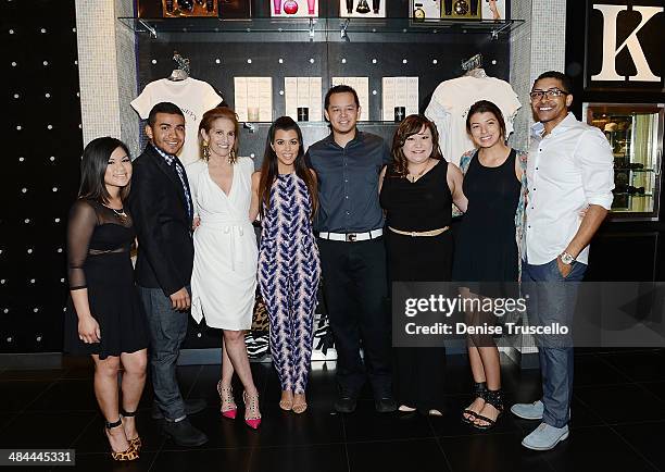 Cici Bussey and Kourtney Kardashian pose for photos with Kardashian Khaos team Kardashian Khaos at The Mirage Hotel and Casino on April 12, 2014 in...