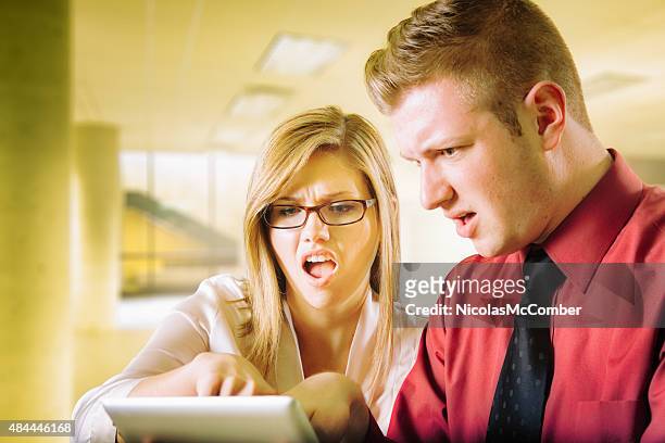 young office team shocked at report on tablet - annoying colleague stock pictures, royalty-free photos & images