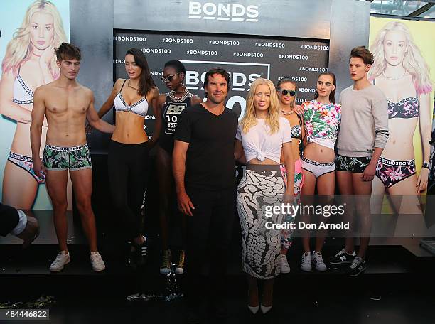 Pat Rafter and Iggy Azalea pose during Bonds 100th birthday celebration event at Cafe Sydney on August 19, 2015 in Sydney, Australia.