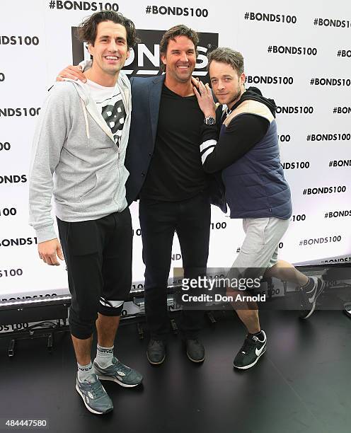 Andy Lee, Pat Rafter and Hamish Blake pose during Bonds 100th birthday celebration event at Cafe Sydney on August 19, 2015 in Sydney, Australia.