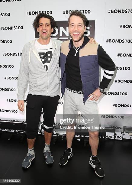 Andy Lee and Hamish Blake pose during Bonds 100th birthday celebration event at Cafe Sydney on August 19, 2015 in Sydney, Australia.