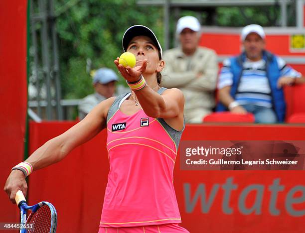 Tennis player Chanelle Scheepers of South African Republic serves a ball to player Jelena Jankovic of Serbia, during their WTA Bogota Open semifinal...