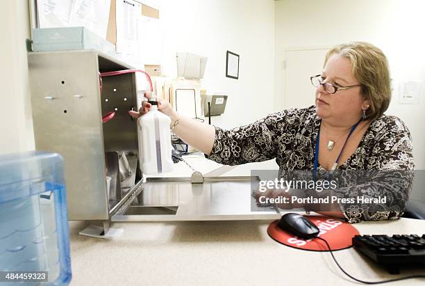 Jack Milton/Staff Photographer: Wednesday, January 9, 2008: Michelle Morin, a registered nurse at Merrimack River Medical Services, administers...