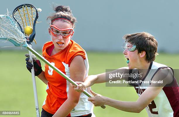 Staff photo by Doug Jones -- -- Friday, May 25 2007: NYA's Ingrid Knowles, takes an aggressive assault from#12 of Greely, Julie Fournier. The...