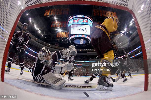 Colin Stevens of the Union College Dutchmen lets in a goal by Justin Kloos of the Minnesota Golden Gophers Taylor Cammarata of the Gophers celebrates...