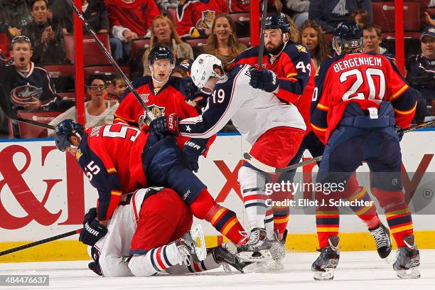 Ed Jovanovski of the Florida Panthers fights with Corey Tropp of the Columbus Blue Jackets at the BB&T Center on April 12, 2014 in Sunrise, Florida.