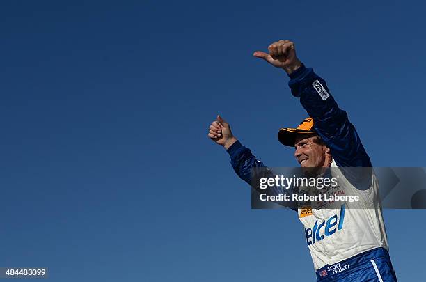 Scott Pruett, driver of the Chip Ganassi Racing Riley DP Ford EcoBoost, celebrates after winning the Tudor United Sports Car Championship Series...