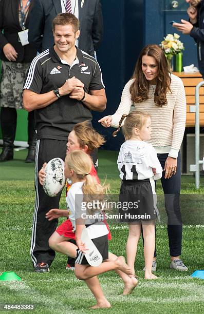 Catherine, Duchess of Cambridge and All Blacks captain Richie McCaw watch a young players' Rugby tournament at Forsyth Barr Stadium on April 13, 2014...