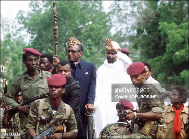 Mobutu Sese Seko, president of Zaire , and Hissene Habré, president of Chad, wave to wellwishers, 20 August 1983, upon Mobutu's arrival to N'djamena.