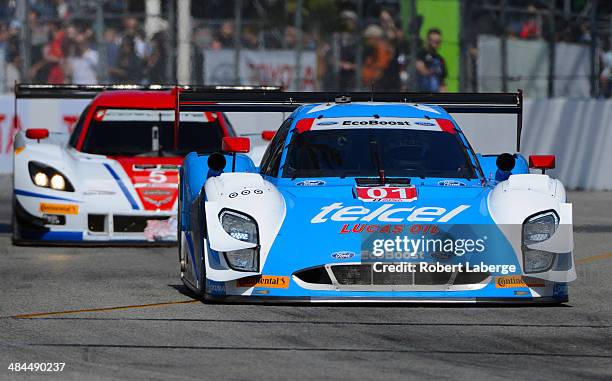 The Chip Ganassi Racing Riley DP Ford EcoBoost of Scott Pruett and Memo Rojas of Mexico leads the Corvette DP Chevrolet of Joao Barbosa of Portugal...