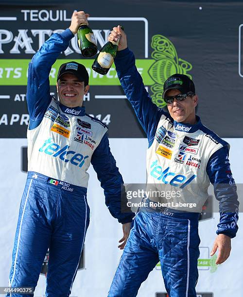Memo Rojas of Mexico and Scott Pruett drivers of the Chip Ganassi Racing Riley DP Ford EcoBoost celebrate after winning the Tudor United Sports Car...