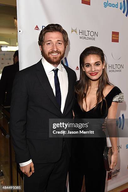 Actors Lucas Neff and Caitlin Stasey attend the 25th Annual GLAAD Media Awards at The Beverly Hilton Hotel on April 12, 2014 in Los Angeles,...