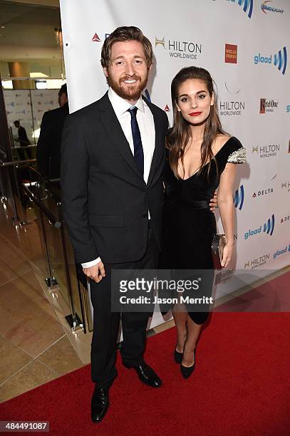 Actors Lucas Neff and Caitlin Stasey attend the 25th Annual GLAAD Media Awards at The Beverly Hilton Hotel on April 12, 2014 in Los Angeles,...