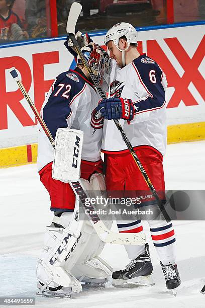 Goaltender Sergei Bobrovsky is congratulated by Nikita Nikitin of the Columbus Blue Jackets after the win against the Florida Panthers at the BB&T...
