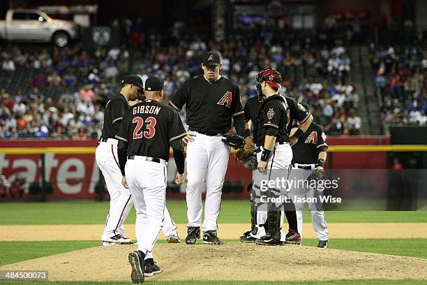 Manager Kirk Gibson of the Arizona Diamondbacks pulls J.J. Putz in the eighth inning against the Los Angeles Dodgers at Chase Field on April 12, 2014...