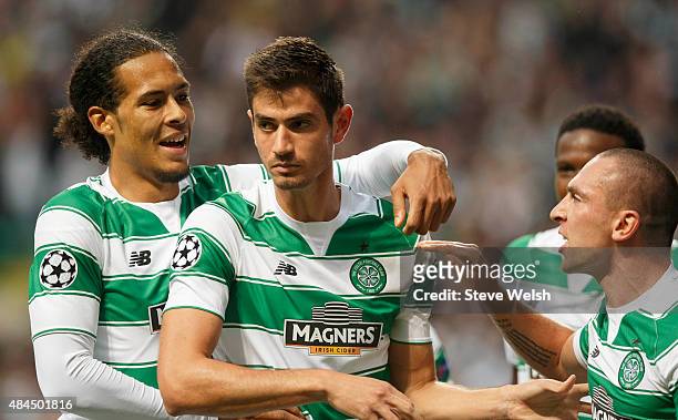 Nir Bitton of Celtic celebrates with team-mates Virgil van Dijk and Scott Brown after scoring his team's second goal during the UEFA Champions League...