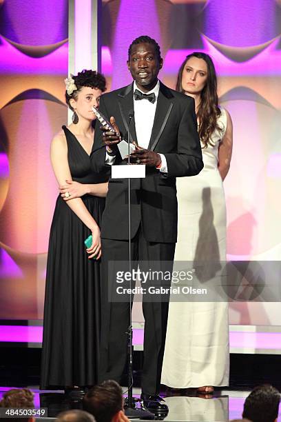 Director Malika Zouhali-Worrall, actor John "Long Jones" Abdallah Wambere and filmmaker Katherine Fairfax Wright accept an award onstage during the...