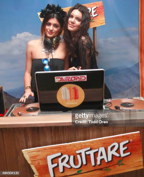 Kylie Jenner and Kendall Jenner spin for festival-goers at the Fruttare Hangout at Coachella on April 12, 2014 in Indio, California.