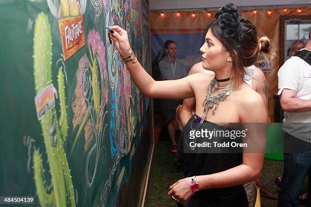 Kylie Jenner shared her "it's all good" moment on a chalk wall at the Fruttare Hangout at Coachella on April 12, 2014 in Indio, California.