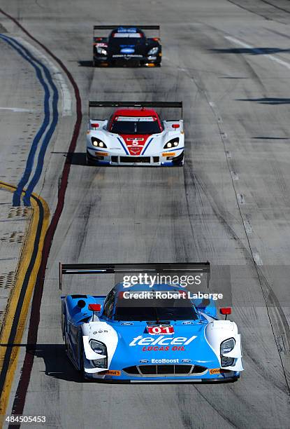 The Chip Ganassi Racing Riley DP Ford EcoBoost of Scott Pruett and Memo Rojas of Mexico leads the Corvette DP Chevrolet of Joao Barbosa of Portugal...