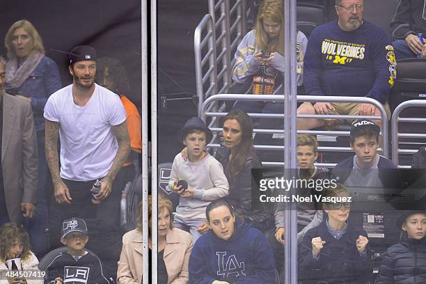 David Beckham, Cruz Beckham, Victoria Beckham, Romeo Beckham and Brooklyn Beckham attend a hockey game between the Anahiem Ducks and the Los Angeles...