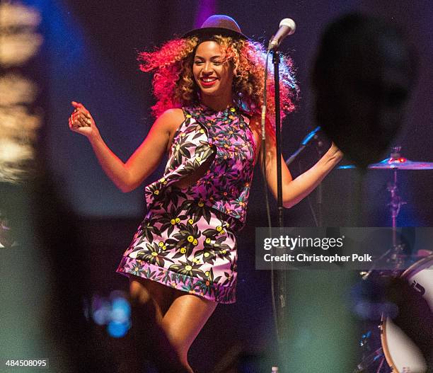 Singer Beyonce performs with her sister Solange onstage during day 2 of the 2014 Coachella Valley Music & Arts Festival at the Empire Polo Club on...