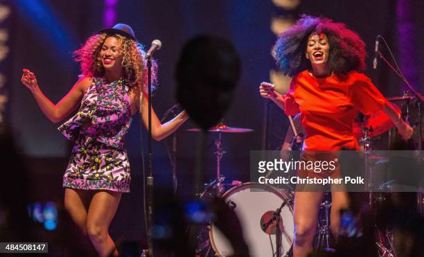 Singer Beyonce performs with her sister Solange onstage during day 2 of the 2014 Coachella Valley Music & Arts Festival at the Empire Polo Club on...