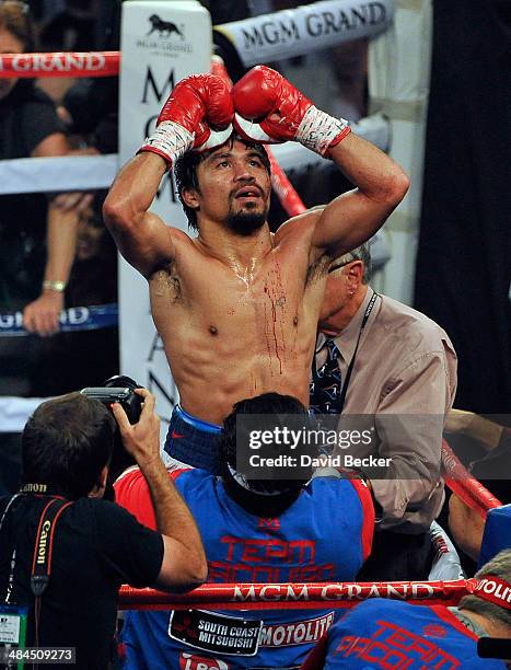 Manny Pacquiao celebrates after his unanimous decision victory over Timothy Bradley during their WBO world welterweight championship boxing match at...