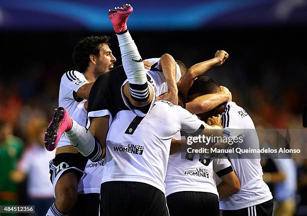 Valencia players celebrate the third goal with during the UEFA Champions League Qualifying Round Play Off First Leg match between Valencia CF and AS...