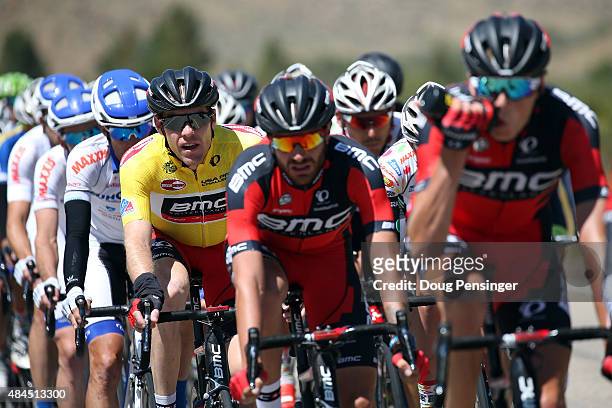 Brent Bookwalter of United States riding for BMC Racing rides under the protection of his team as he defends the overall race leader yellow jersey...