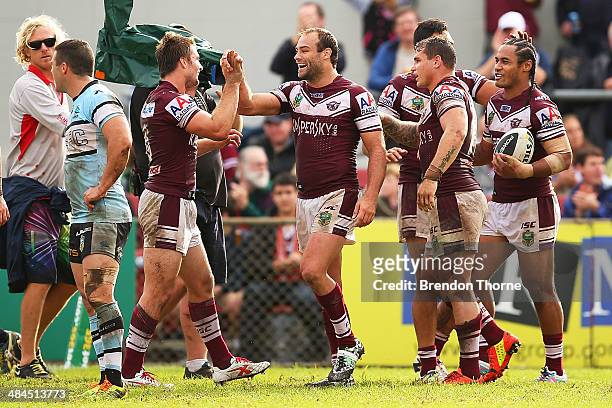 Steve Matai of the Sea Eagles celebrates with team mates after scoring a try during the round 6 NRL match between the Manly-Warringah Sea Eagles and...