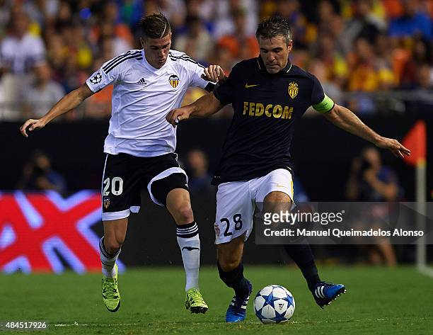 Rodrigo De Paul of Valencia battle for the ball with Jeremy Toulalan of Monaco during the UEFA Champions League Qualifying Round Play Off First Leg...
