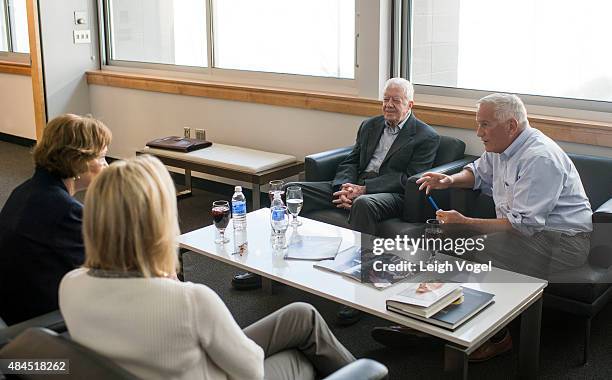 President Jimmy Carter and Former First Lady Rosalynn Carter speak with Aspen Institute president and CEO Walter Isaacson and Cathy Isaacson during...