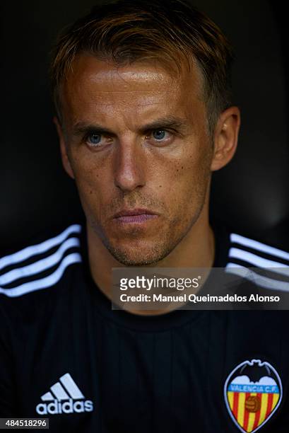 Valencia CF assistant coach Phil Neville looks on prior to the UEFA Champions League Qualifying Round Play Off First Leg match between Valencia CF...