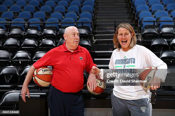 Mike Thibault of the Washington Mystics jokes with Cheryl Reeve of the Minnesota Lynx before a game on August 19, 2015 at Target Center in...