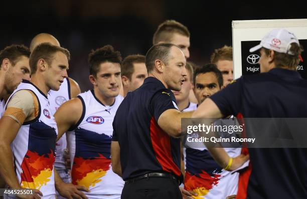 Brenton Sanderson the coach of the Crows talks to his players during the round four AFL match between the St Kilda Saints and the Adelaide Crows at...