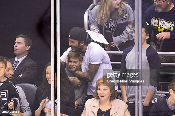 Romeo Beckham, David Beckham and Brooklyn Beckham attend a hockey game between the Anahiem Ducks and the Los Angeles Kings at Staples Center on April...