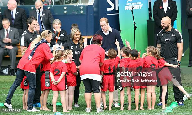Prince William, Duke of Cambridge talks with the junior rippa rugby players while All Blacks Sevens captain DJ Forbes and Ben Smith of the All Blacks...