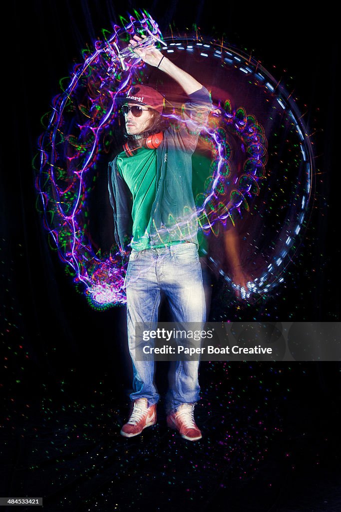 One man dancing with long exposure strobe light