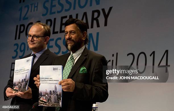 Chairman of the Intergovernmental Panel on Climate Change Rajendra Pachauri and Ottmar Edenhofer, co-Chair of the IPCC Working Group III pose with a...