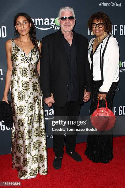 Actress Blake Perlman, actor Ron Perlman and jewelry designer Opal Stone attend the premiere of Amazon's series "Hand Of God" held at the Ace Theater...