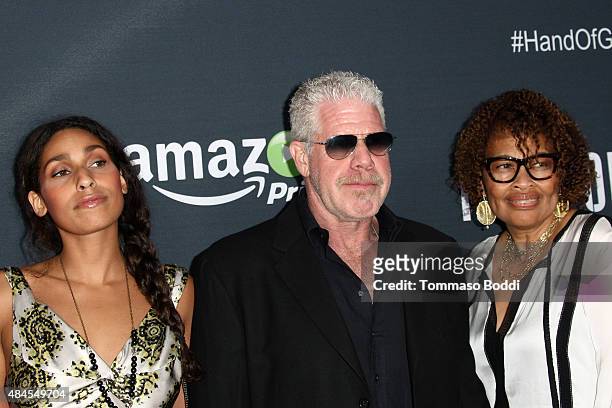 Actress Blake Perlman, actor Ron Perlman and jewelry designer Opal Stone attend the premiere of Amazon's series "Hand Of God" held at the Ace Theater...