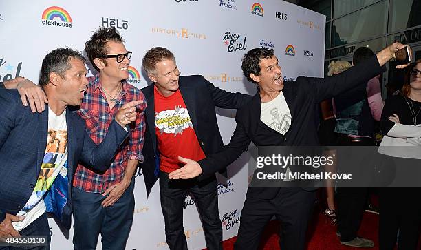 Producer Jeff Tremaine, actor Johnny Knoxville, director Daniel Junge, and BMX racer Mat Hoffman take a selfie at the Los Angeles Premiere of "Being...