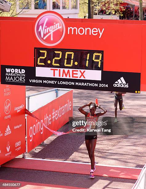 Edna Kiplagat crosses the finish line to win the women's elite race at the Virgin London Marathon on April 13, 2014 in London, England.
