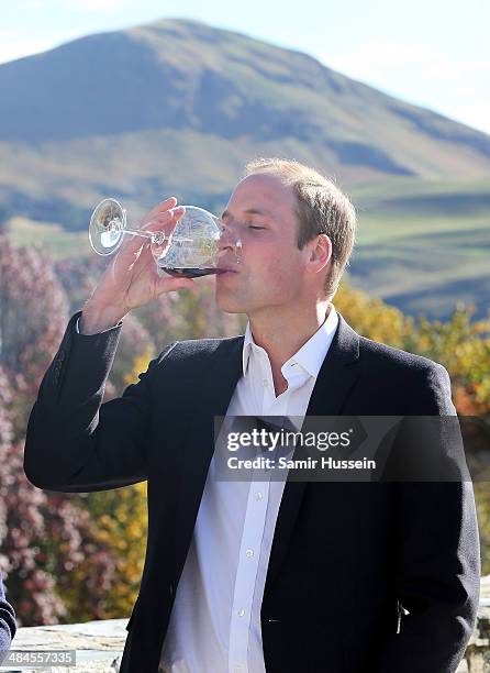 Prince William, Duke of Cambridge samples red wine as the visit Otago Wines at Amisfield winery on April 13, 2014 in Queenstown, New Zealand. The...