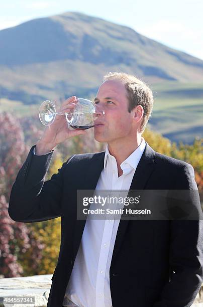 Prince William, Duke of Cambridge samples red wine as the visit Otago Wines at Amisfield winery on April 13, 2014 in Queenstown, New Zealand. The...