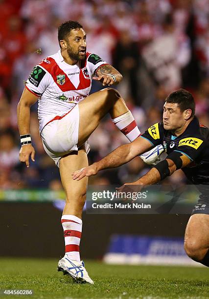 Benji Marshall of the Dragons kicks a field goal during the round 24 NRL match between the St George Illawarra Dragons and the Penrith Panthers at...