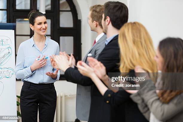 applause after sucessfull presentation - adulation stock pictures, royalty-free photos & images