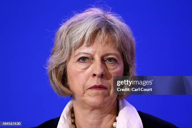 Britain's Home Secretary Theresa May speaks to the media at a press conference after signing an agreement to tackle the migrant crisis in Calais on...