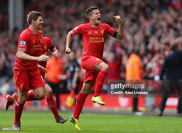 Philippe Coutinho of Liverpool celebrates scoring his team's third goal during the Barclays Premier League match between Liverpool and Manchester...